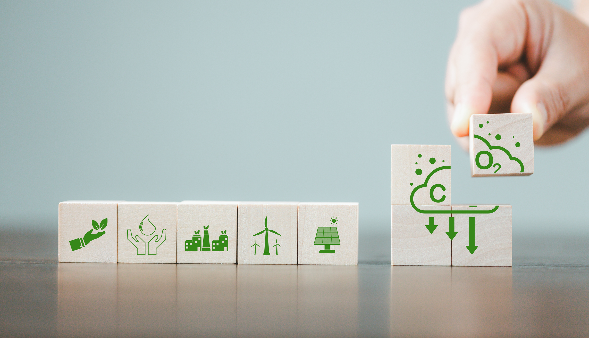 Companies are targeting net zero greenhouse gas emissions. Carbon credit concept.Tradable certificate to drive industry in direction of low emissions in efficiency cost. Wooden cubes with decrease CO2